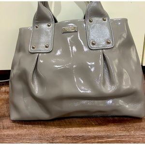 In EXCELLENT condition grey Patent leather bag made by Kate Spade New York